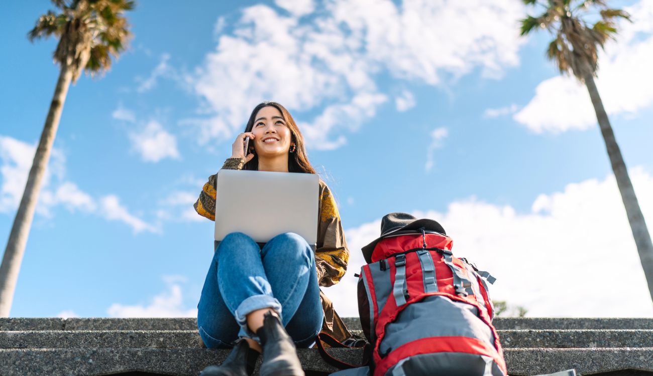 Woman with Backpack, Phone and Laptop : Traveler Staying Safe